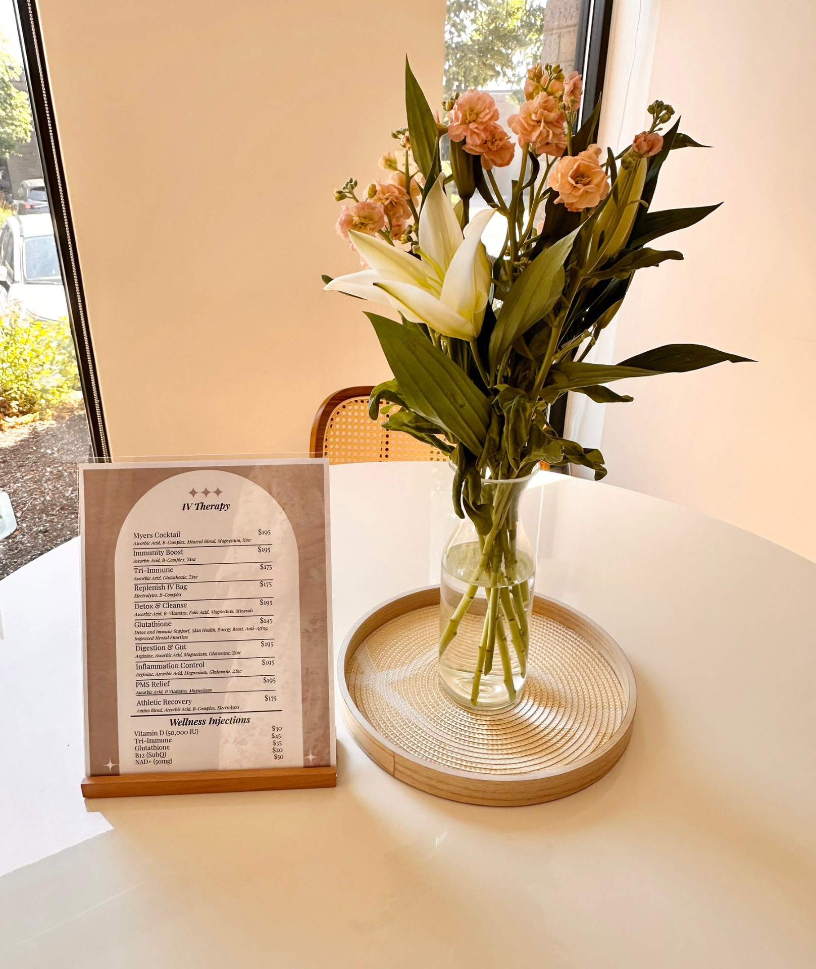 Flowers and the IV therapy menu in the Shine lounge